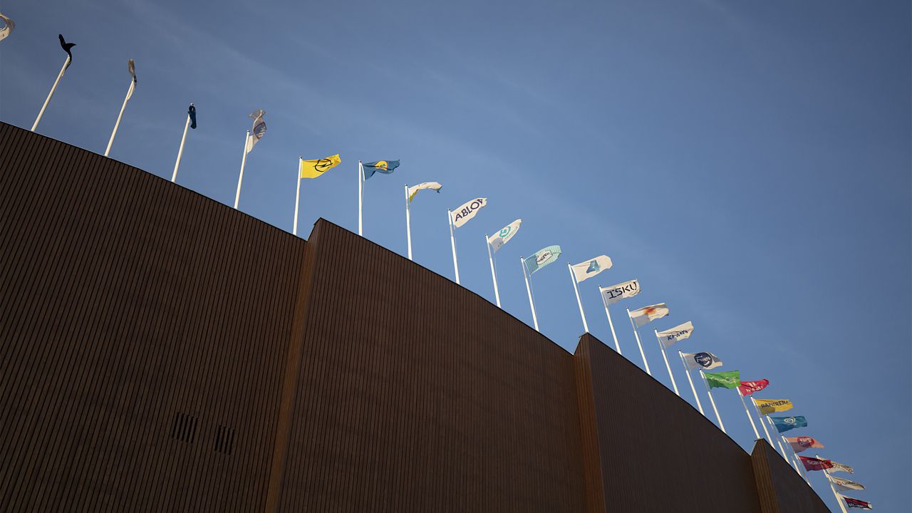 Various flags on top of the stadium