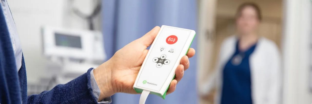Nurse call device on a hospital bed
