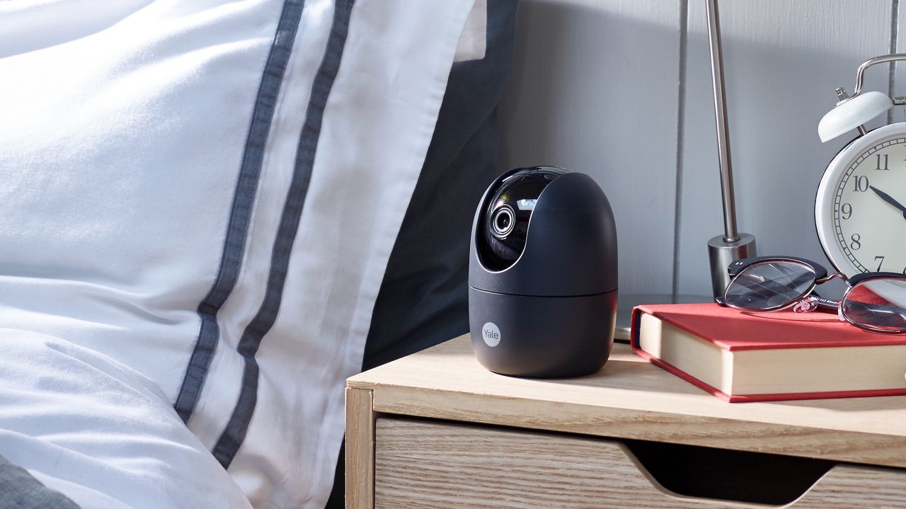Yale Pan and Tilt camera on nightstand.