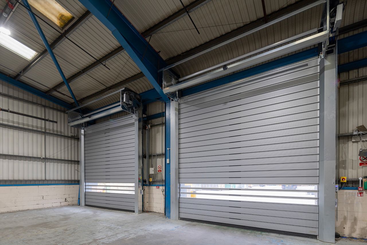 An internal view of two ASSA ABLOY RT1000 spiral doors at a logistics centre