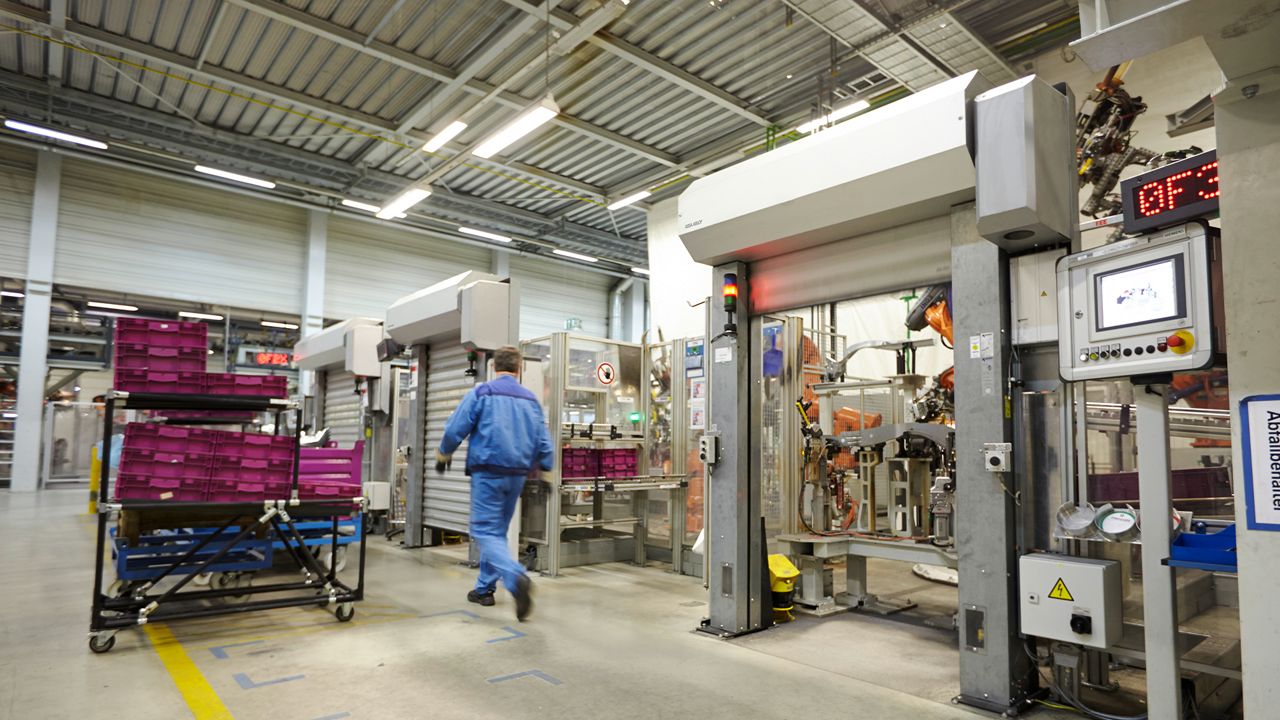 A RP2000 door in an industrial environment with a worker walking. 