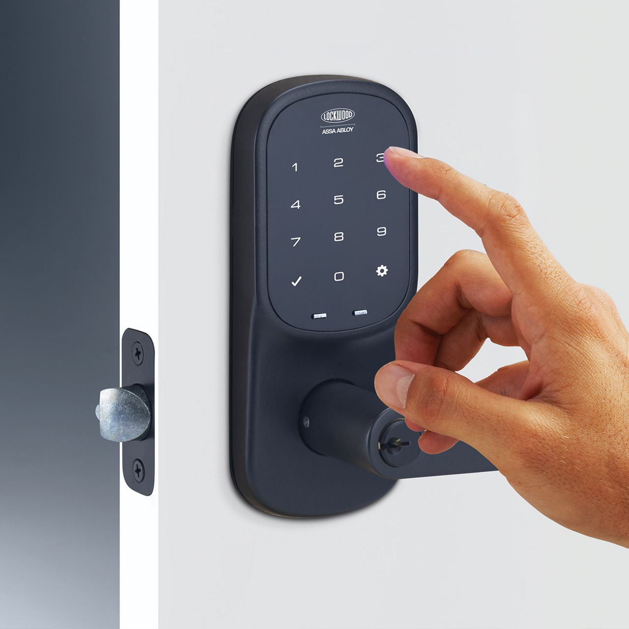 SDL Leverset front door lock hand on keypad