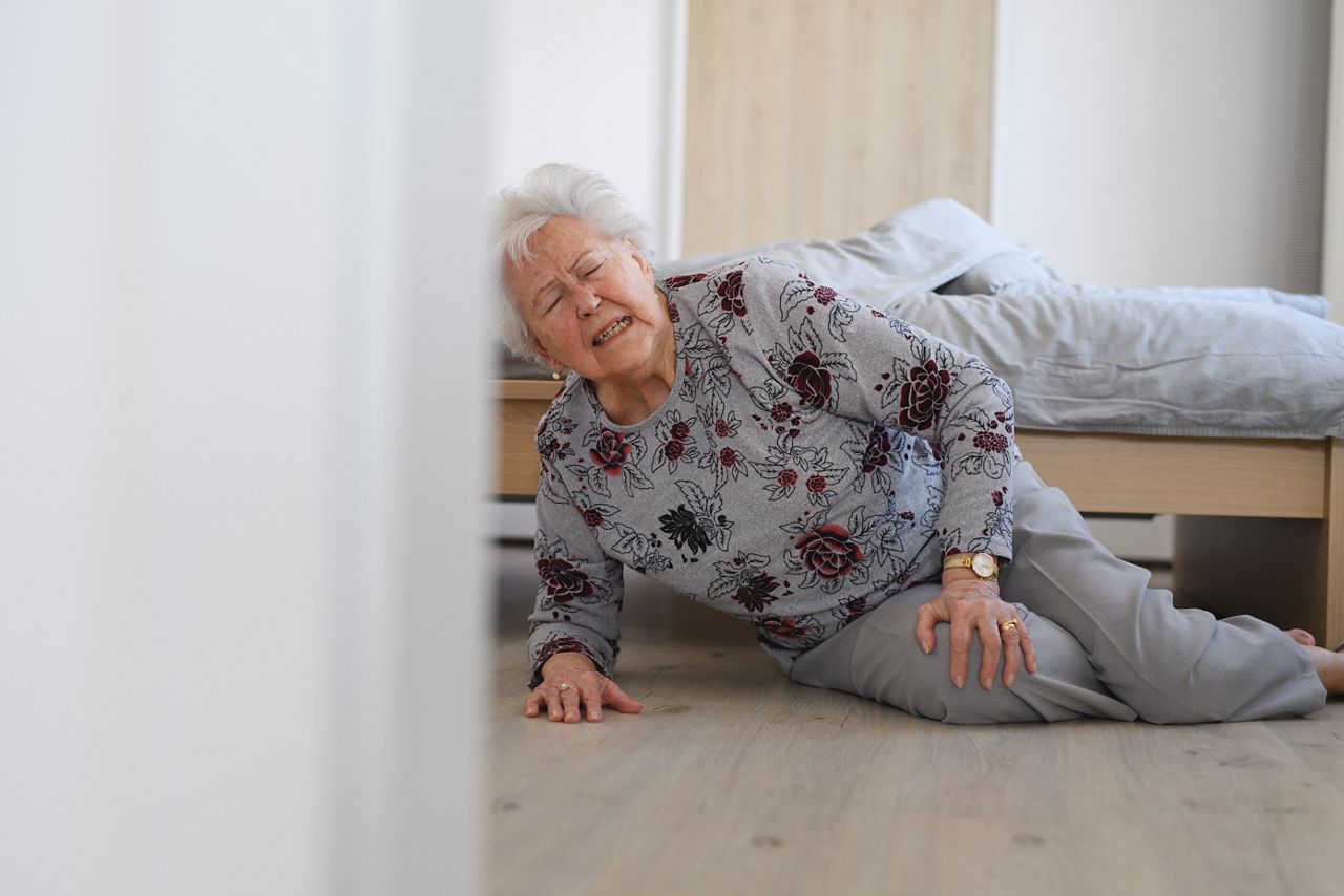 Eldery woman fell out of bed.