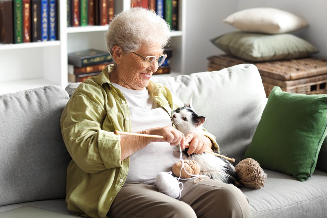 Senior women with cat.