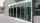 Frontview of the ASSA ABLOY SL500 Telescopic doors in a public building with glass walls.