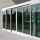 Frontview of the ASSA ABLOY SL500 Telescopic doors in a public building with glass walls.