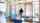 man exiting a hotel through a sliding glass door