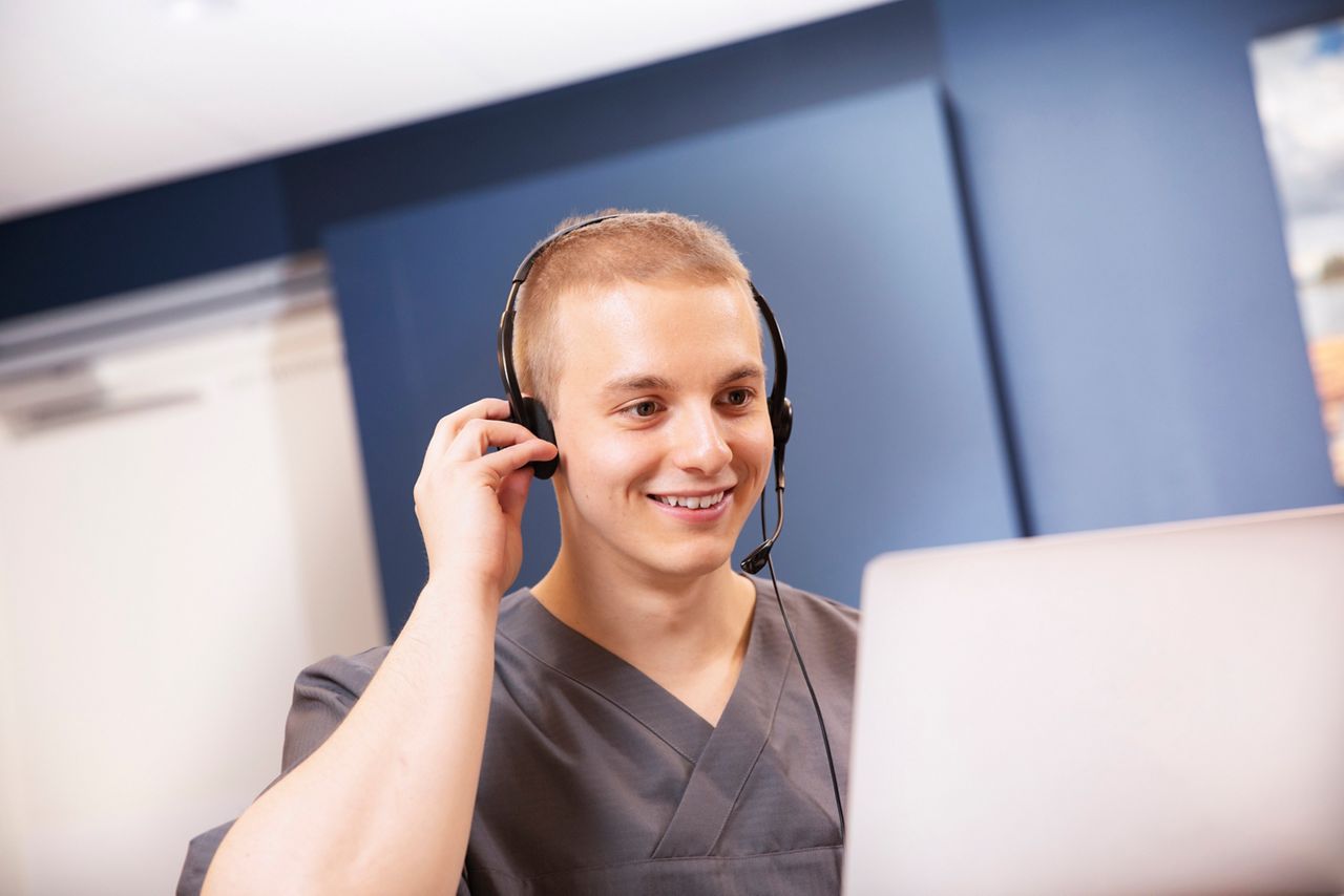 Male nurse talking on the phone.