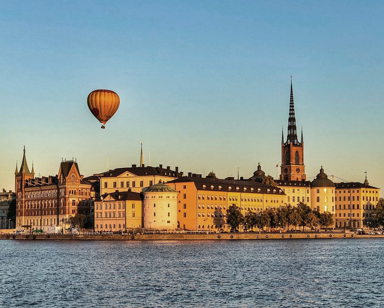 Stockholm in sunset with baloon in the air.