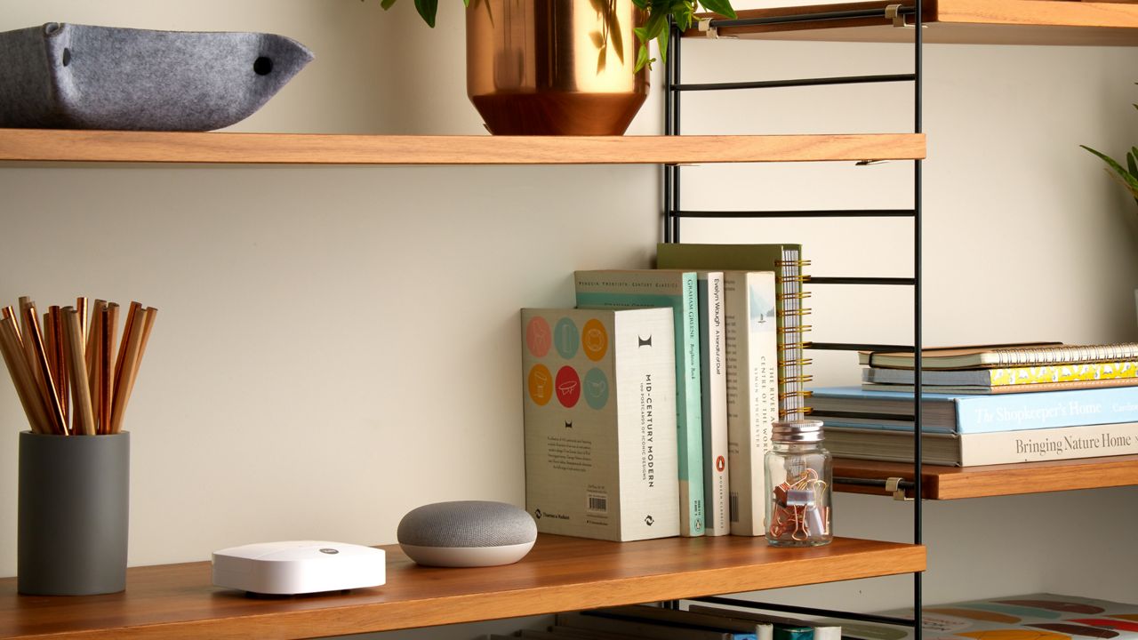 Google Home on white table.