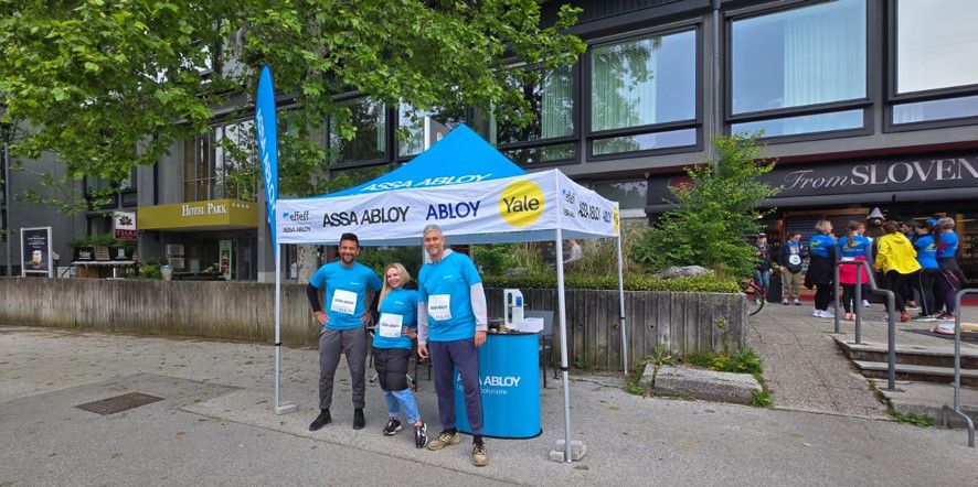 Assa Abloy tent with people next to it