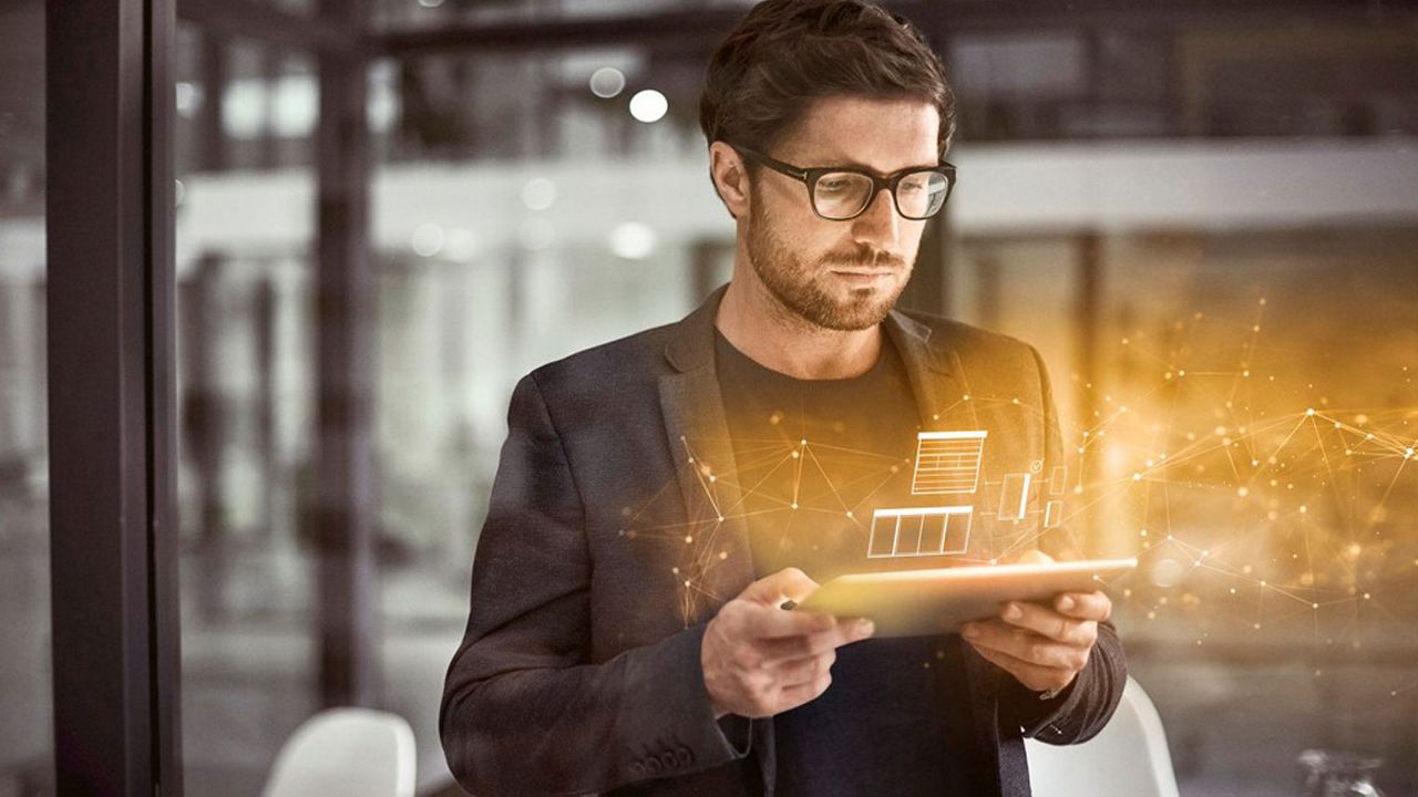 Man looking at a screen device.