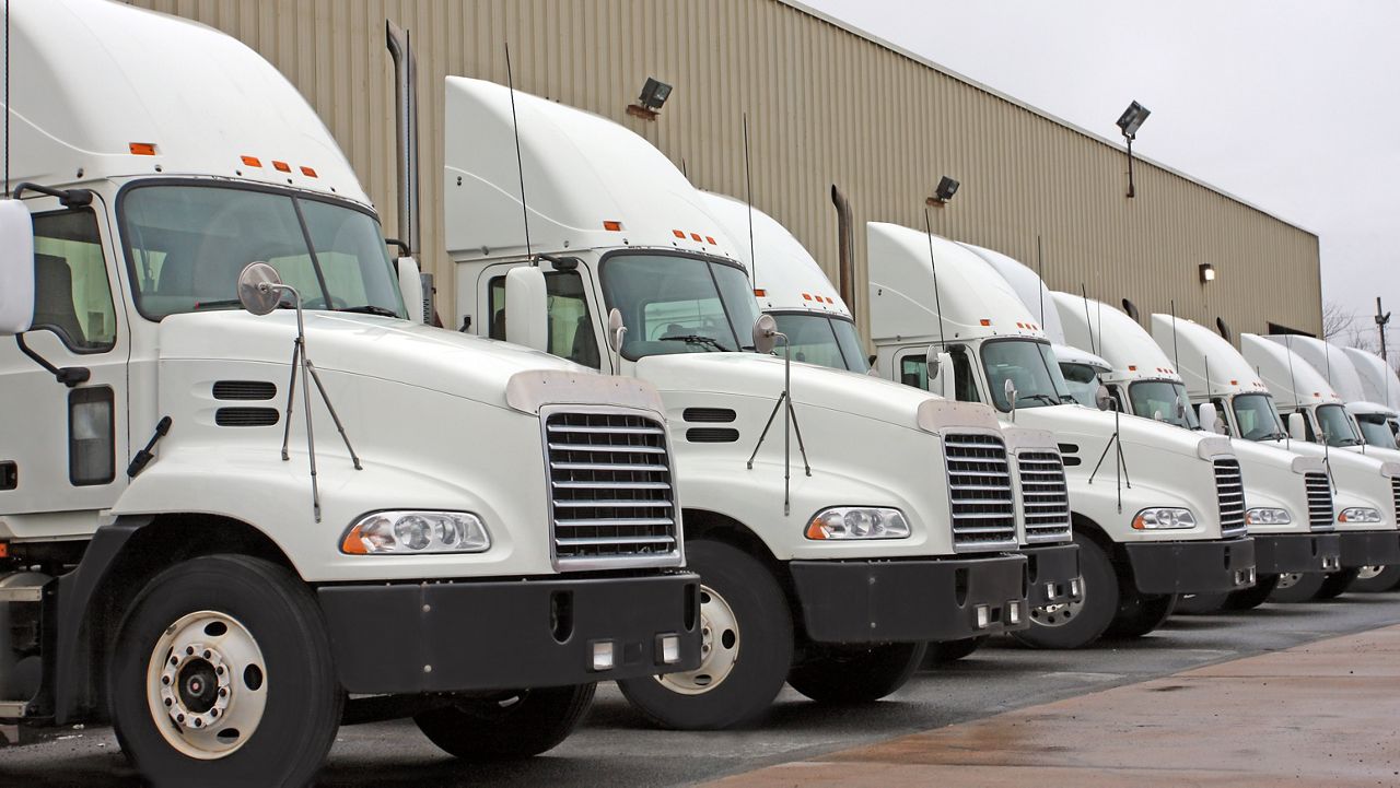 Fleet of tractor trucks at distribution facility