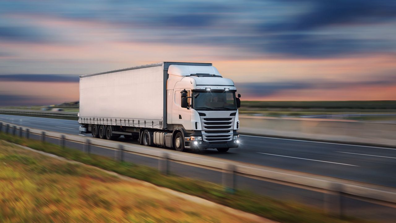 A truck driving on a road.