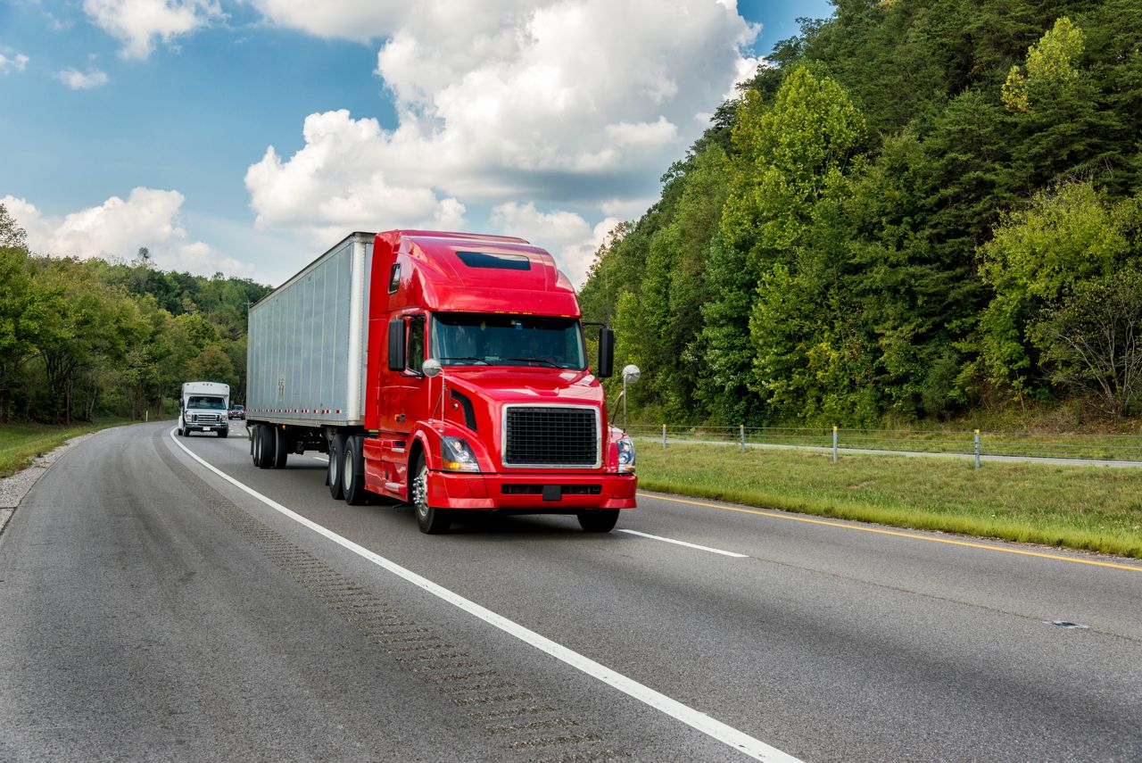 Shipping truck traveling on highway