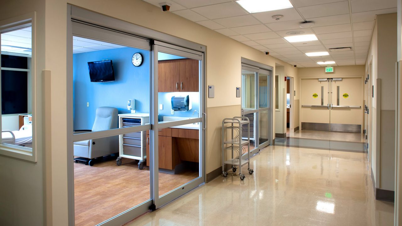 Sliding doors on both sides in hospital corridor