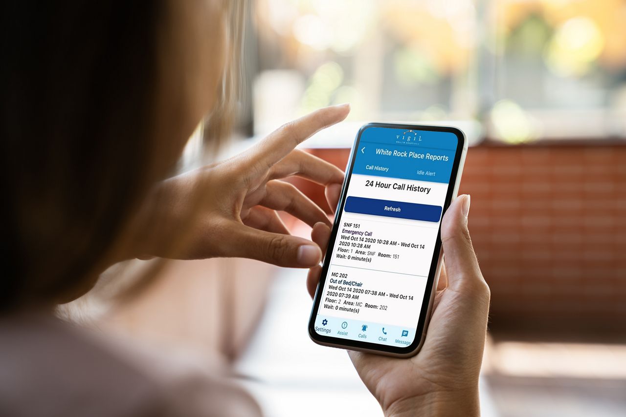 Person looking at nurse call history in mobile device.