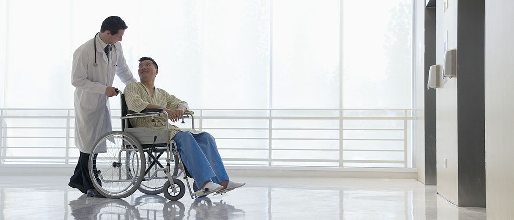 Doctor with patient in wheelchair