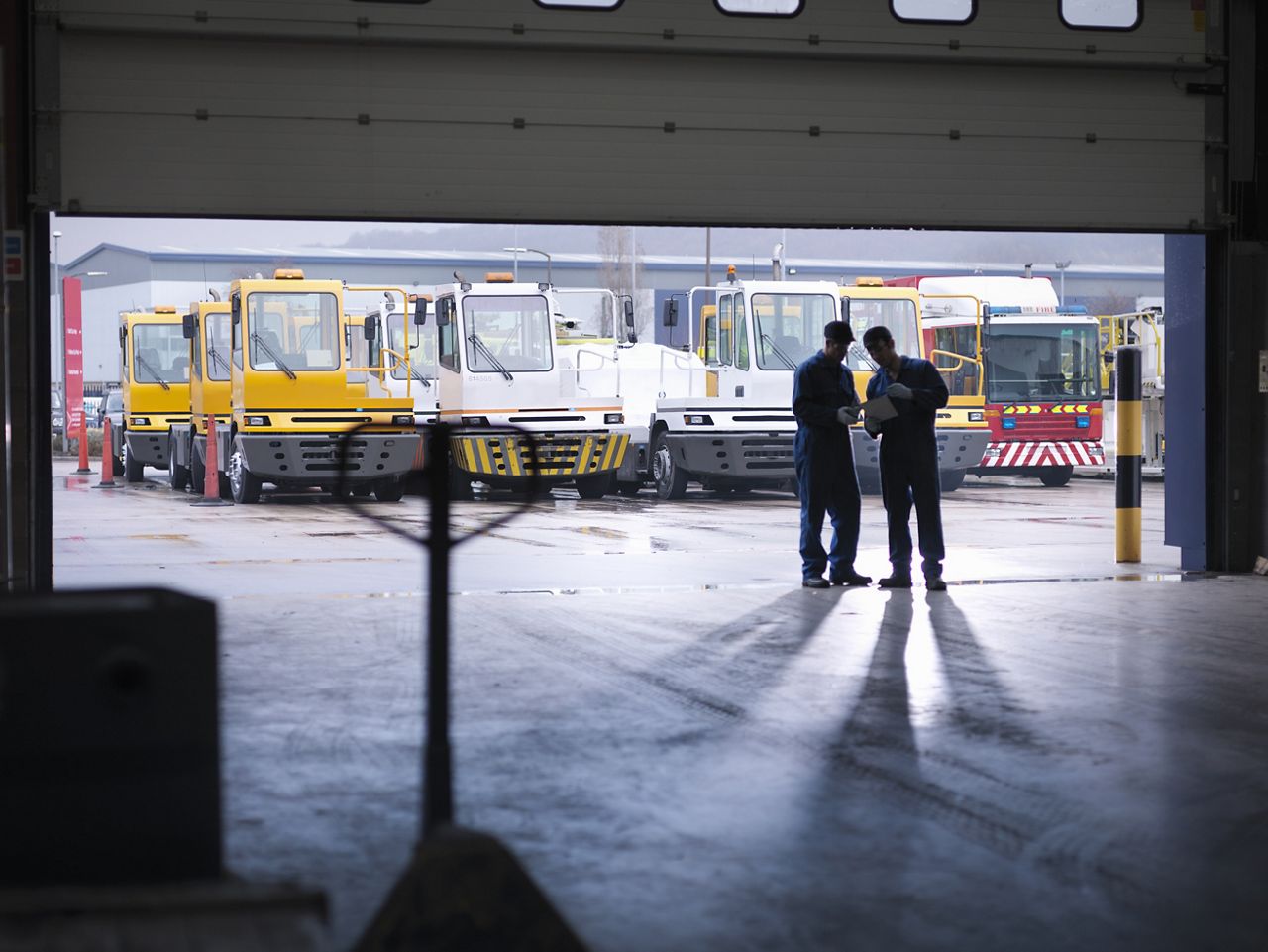 Image of two men working in a factory