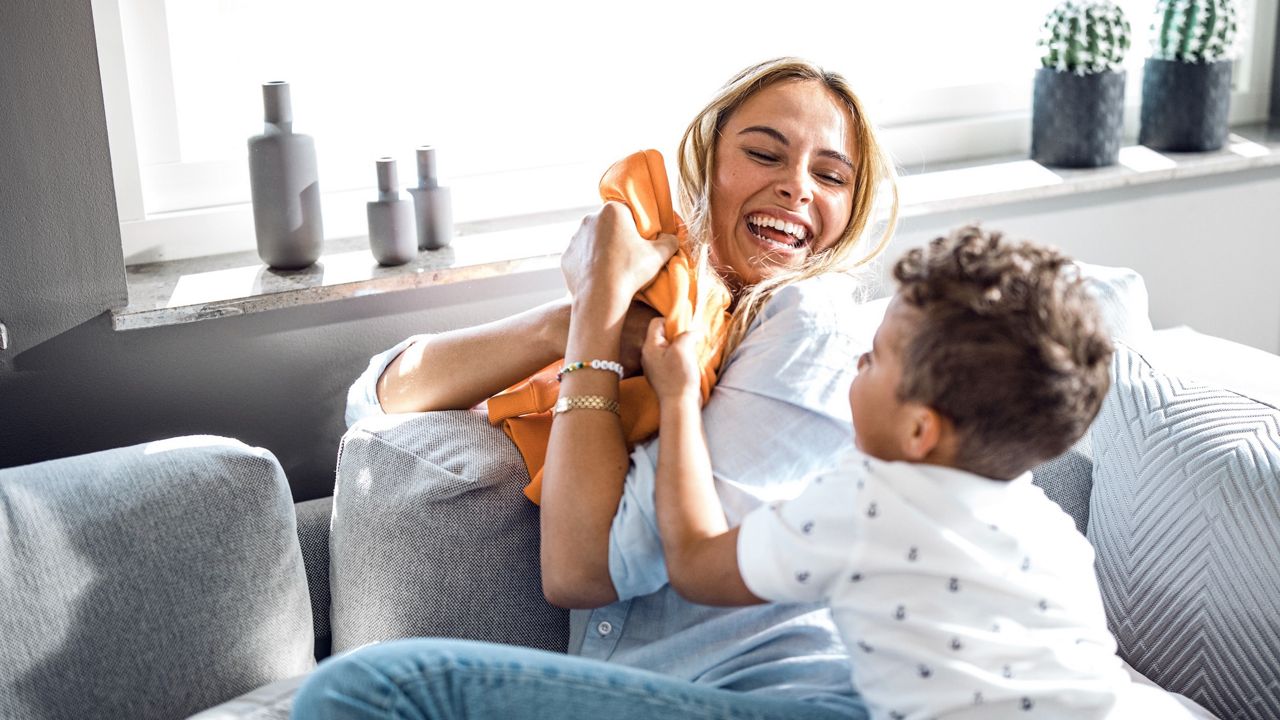 Mother and kid playing together