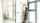 Woman entering room through fire safety door