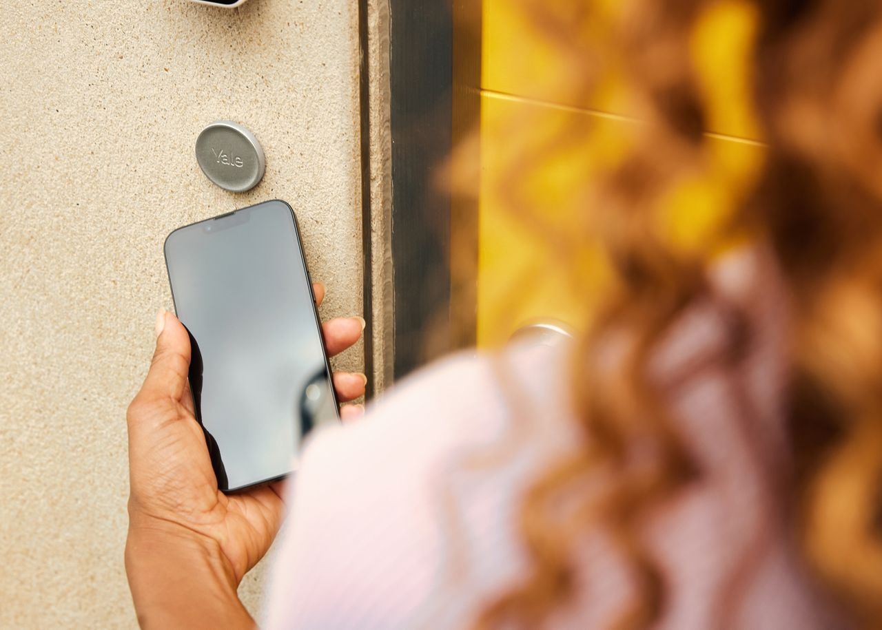 Woman using Yale Dot®