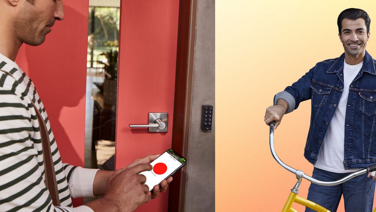 A man opening the front door with Yale Access